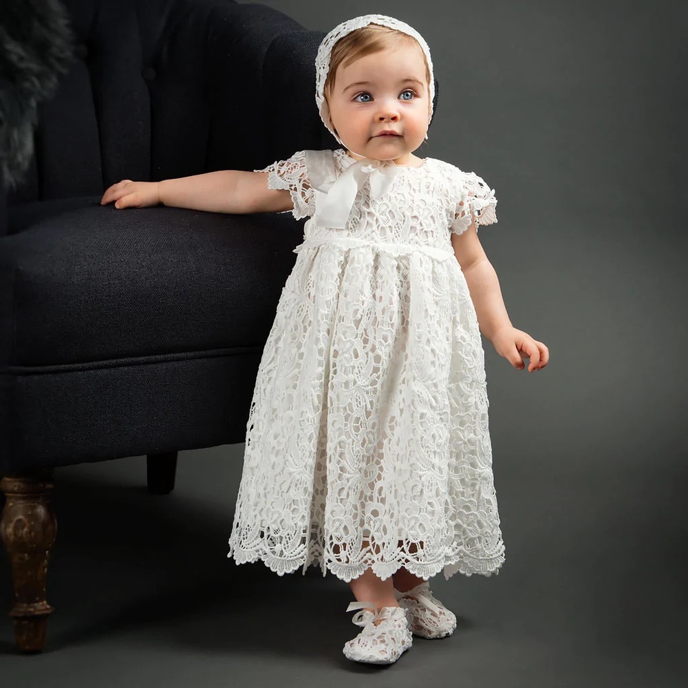 Baptism / Christening dress made out of eyelet fabric. Comes with head piece.